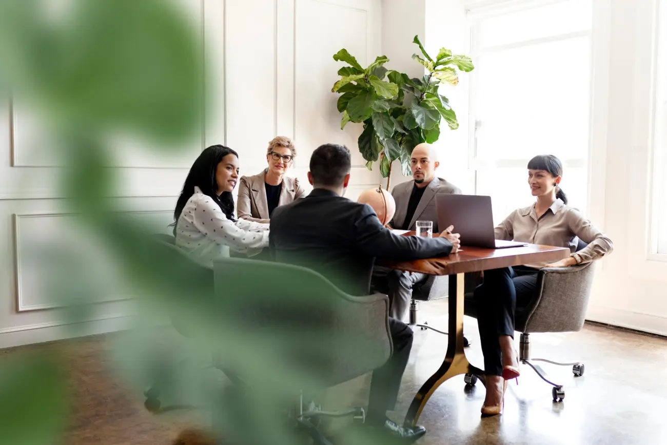 A team meeting round a boardroom table
